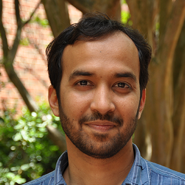 A man with a beard and blue shirt