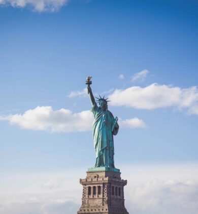 A statue of liberty on top of the ocean.