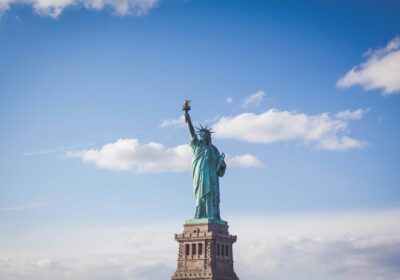 A statue of liberty on top of the ocean.