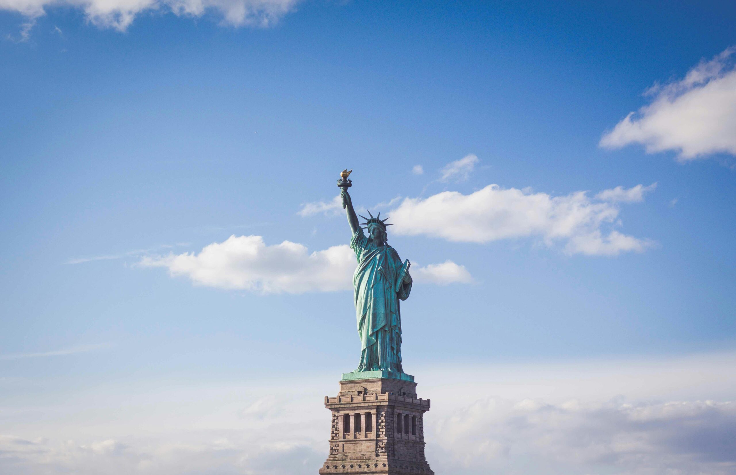 A statue of liberty on top of the ocean.