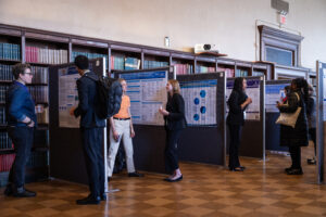 image shows multiple scientific posters being presented at the NY Academy of Medicine in April 2025