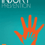 Journal of Injury Prevention cover showing a large and small hand