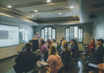 Image of teacher speaking to a classroom of adult students