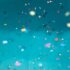 image of colorful confetti on a teal background